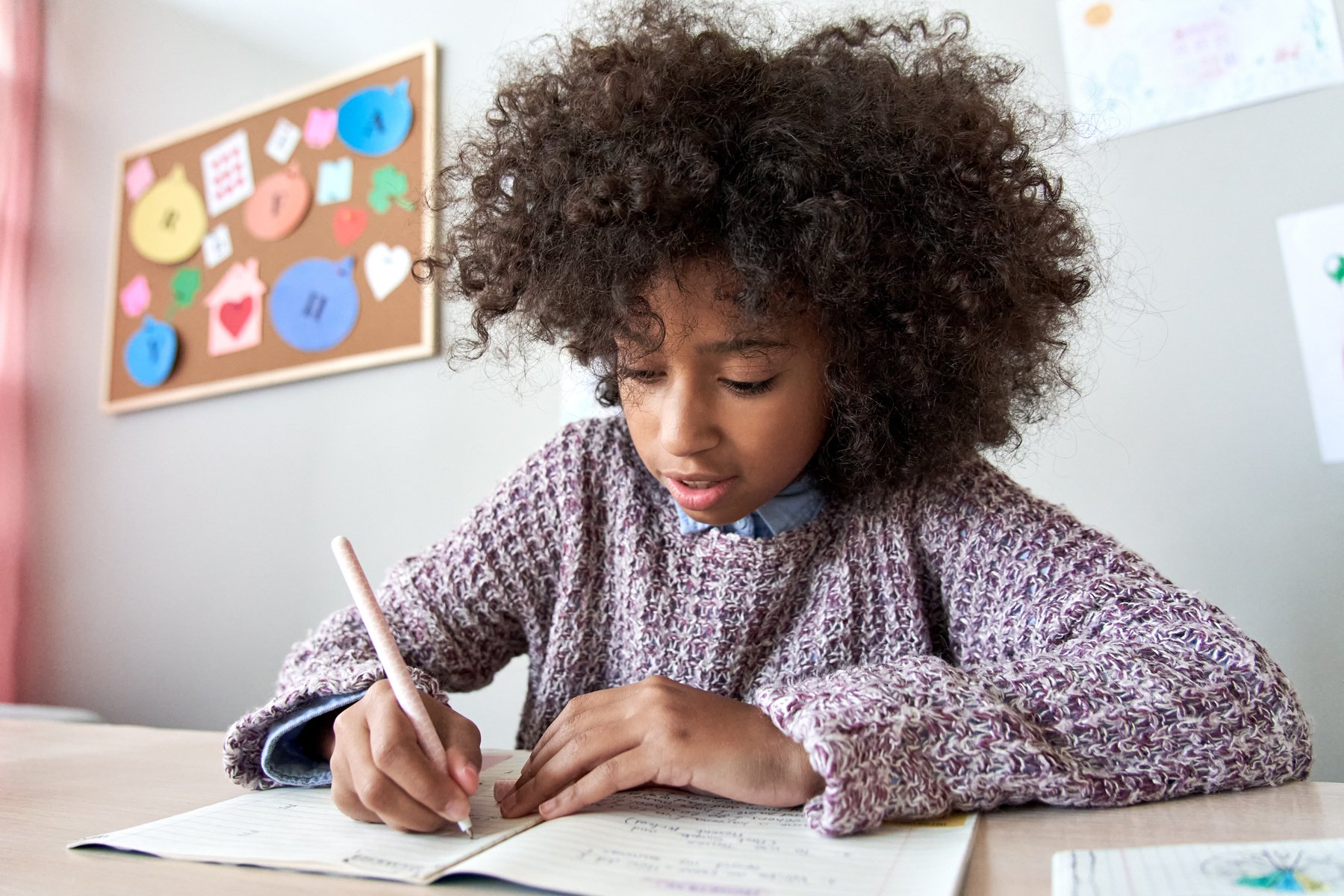 Happy African School Child Girl Studying Writing Homework, Learning at Home.